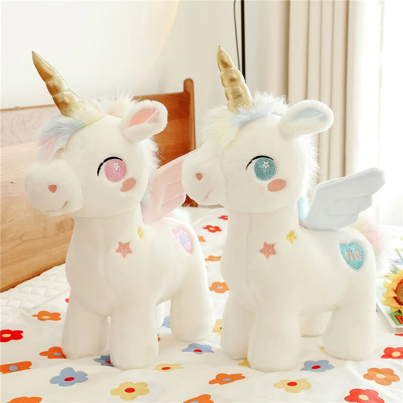 Peluche licorne blanche étoilée avec ailes et corne dorée