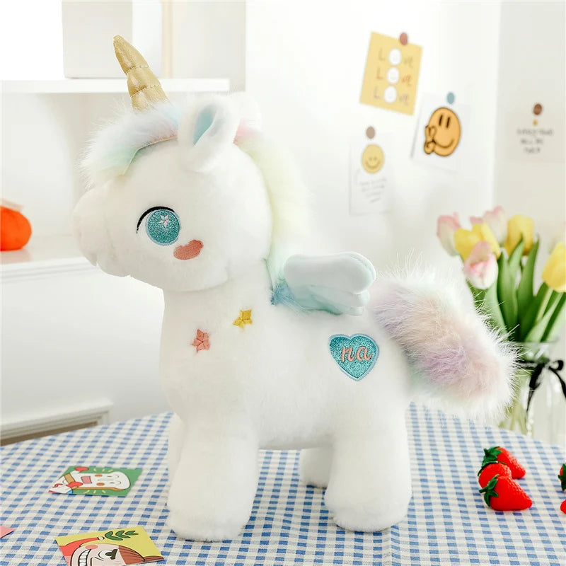 Peluche licorne blanche étoilée avec ailes et corne dorée