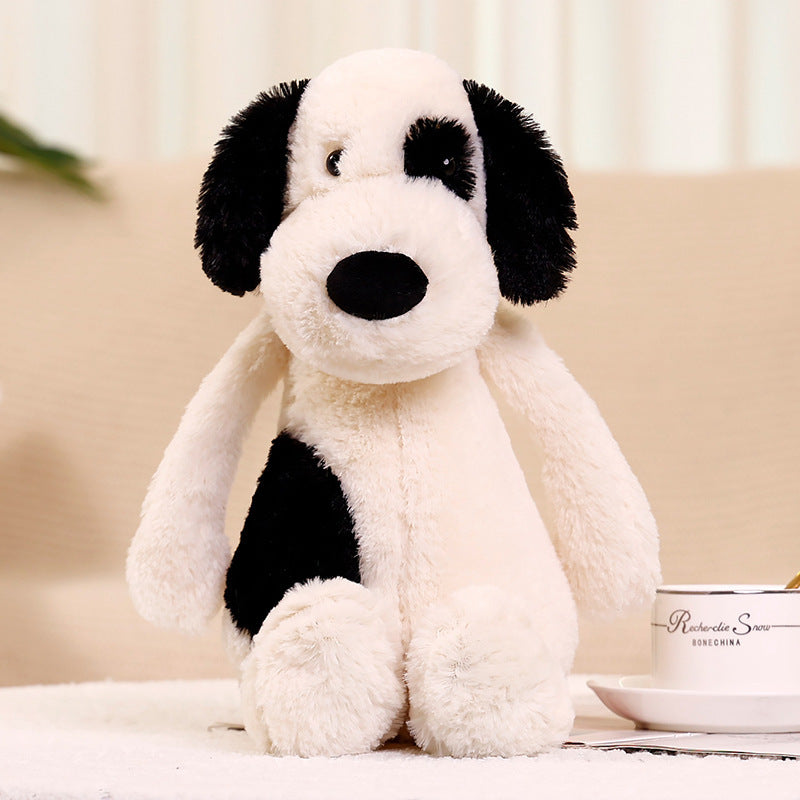 Peluche chien blanc avec un œil noir