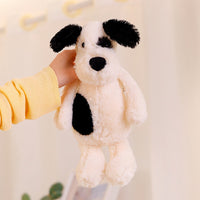 Peluche chien blanc avec un œil noir