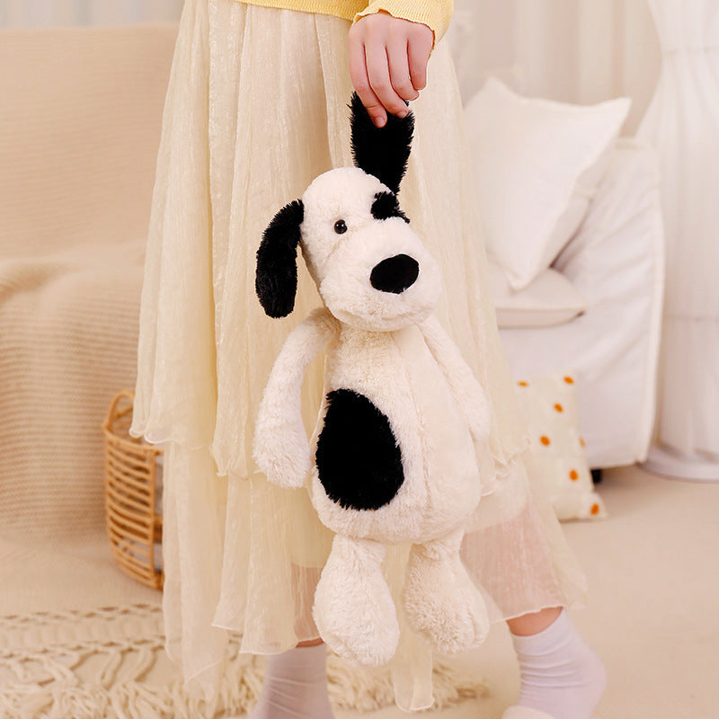 Peluche chien blanc avec un œil noir