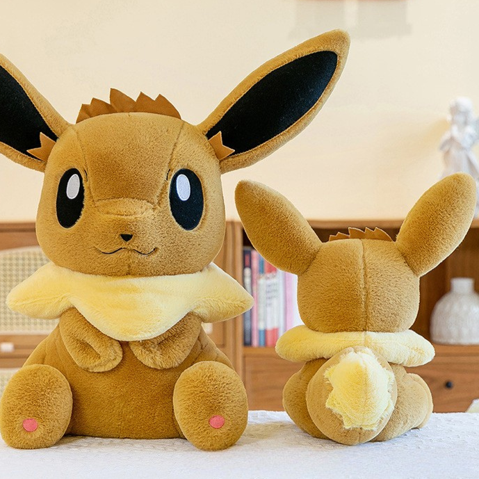 Peluche évoli pokémon assise toute douce