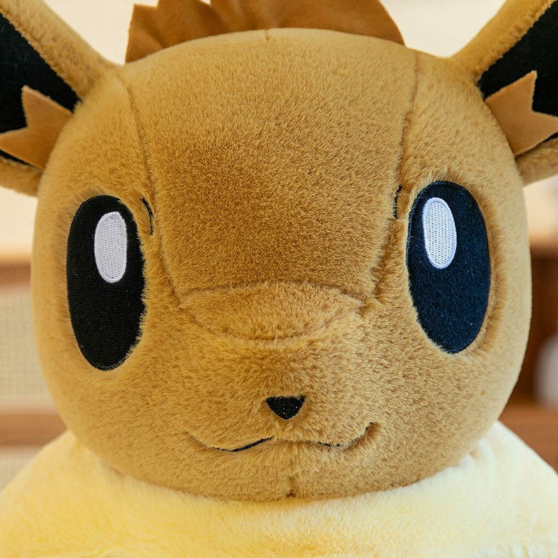 Peluche évoli pokémon assise toute douce