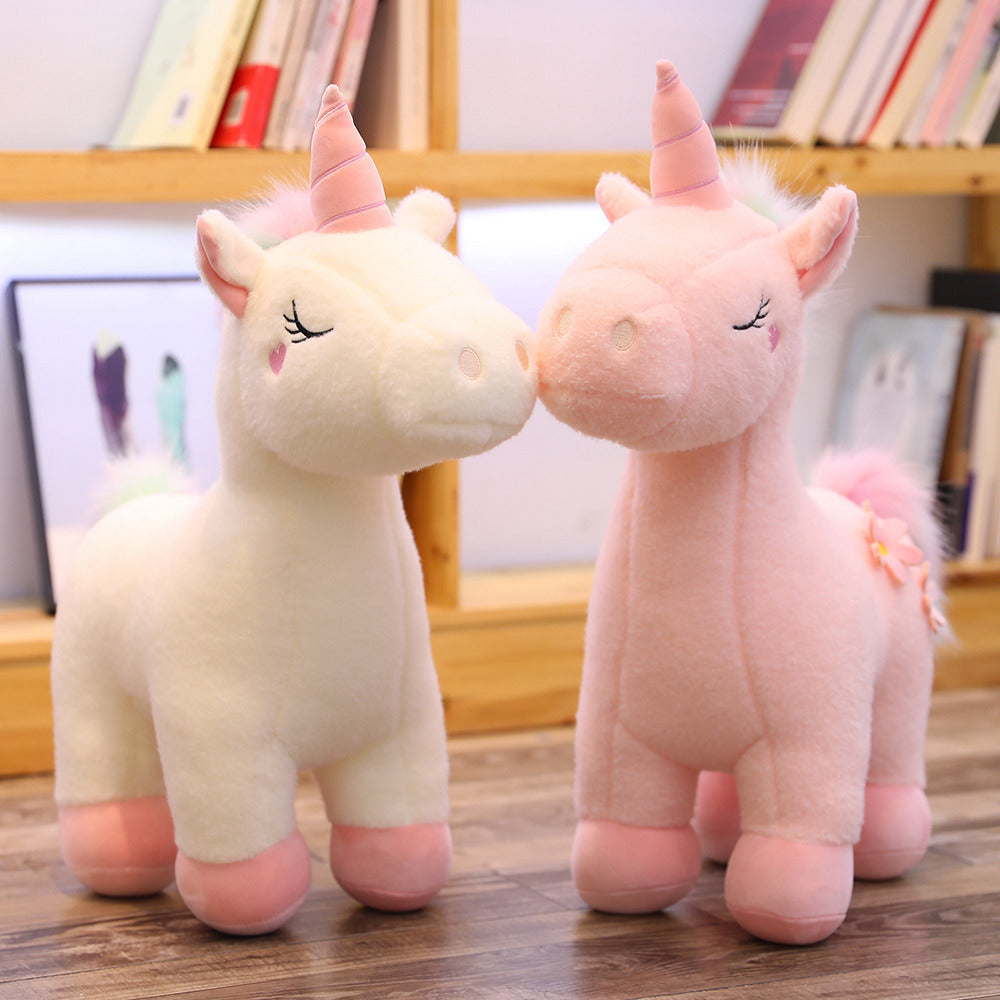 Peluche licorne blanche fleurie avec crinière arc-en-ciel