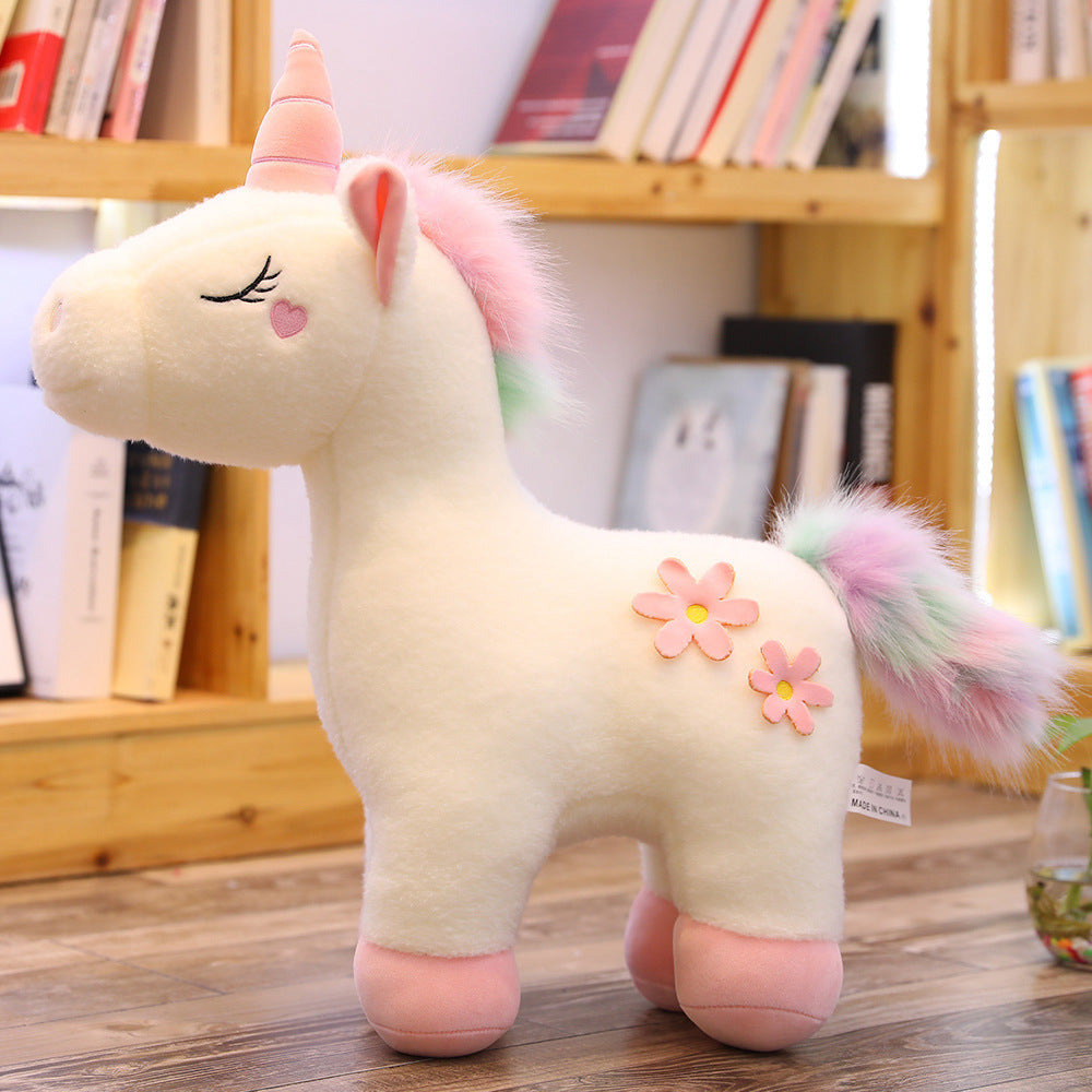 Peluche licorne blanche fleurie avec crinière arc-en-ciel