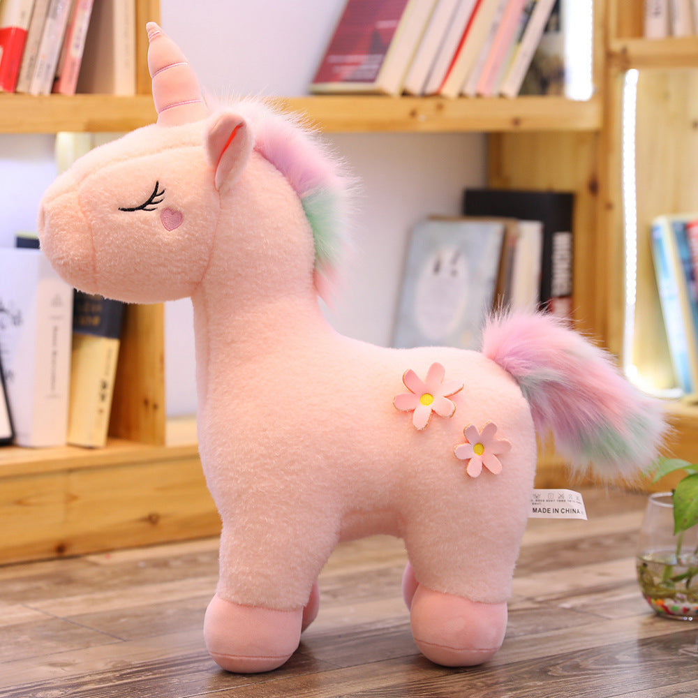 Peluche licorne blanche fleurie avec crinière arc-en-ciel