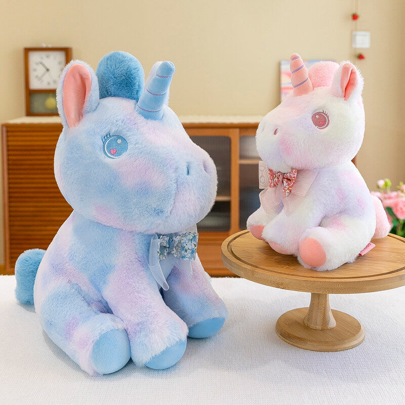 Peluche licorne douce pastel et arc en ciel