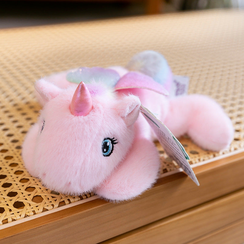 Peluche licorne rose allongée ultra douce avec ailes pailletées
