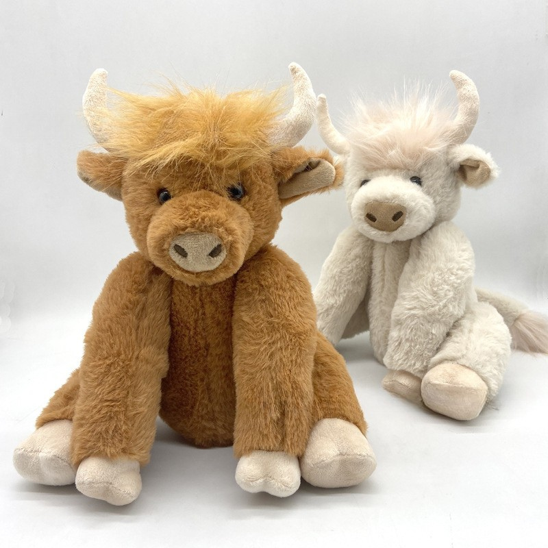 Peluche vache highland marron avec couronne de fleurs