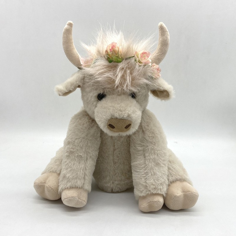Peluche vache highland blanche avec couronne de fleurs
