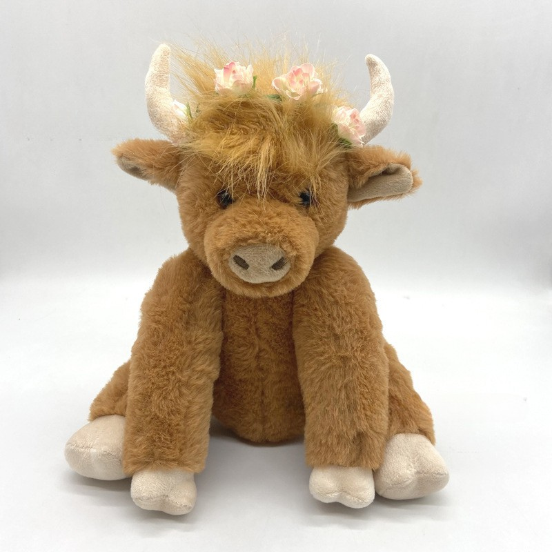 Peluche vache highland marron avec couronne de fleurs