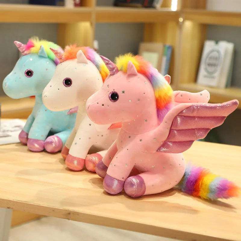 Peluche licorne rose à crinière arc-en-ciel magique