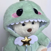 Ours en peluche déguisé en dinosaure