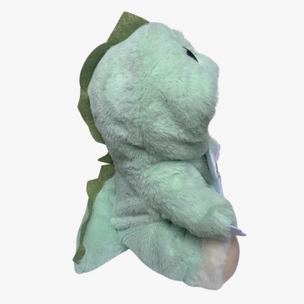 Ours en peluche déguisé en dinosaure