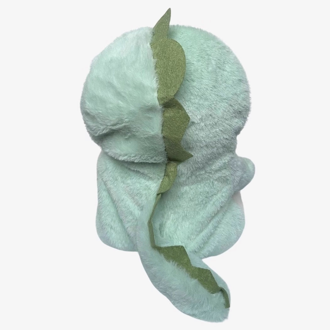 Ours en peluche déguisé en dinosaure