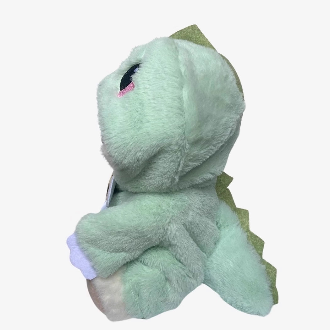 Ours en peluche déguisé en dinosaure