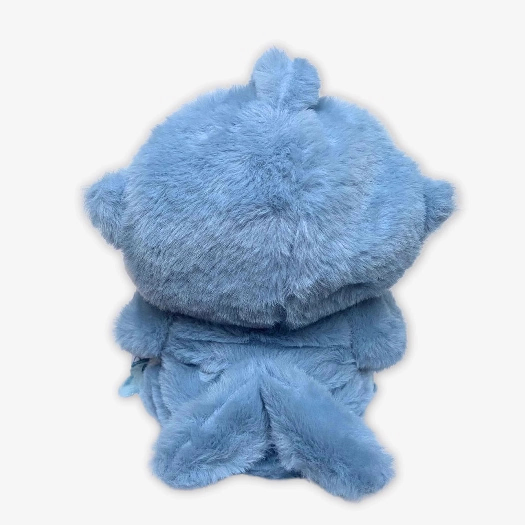 Ours en peluche déguisé en requin