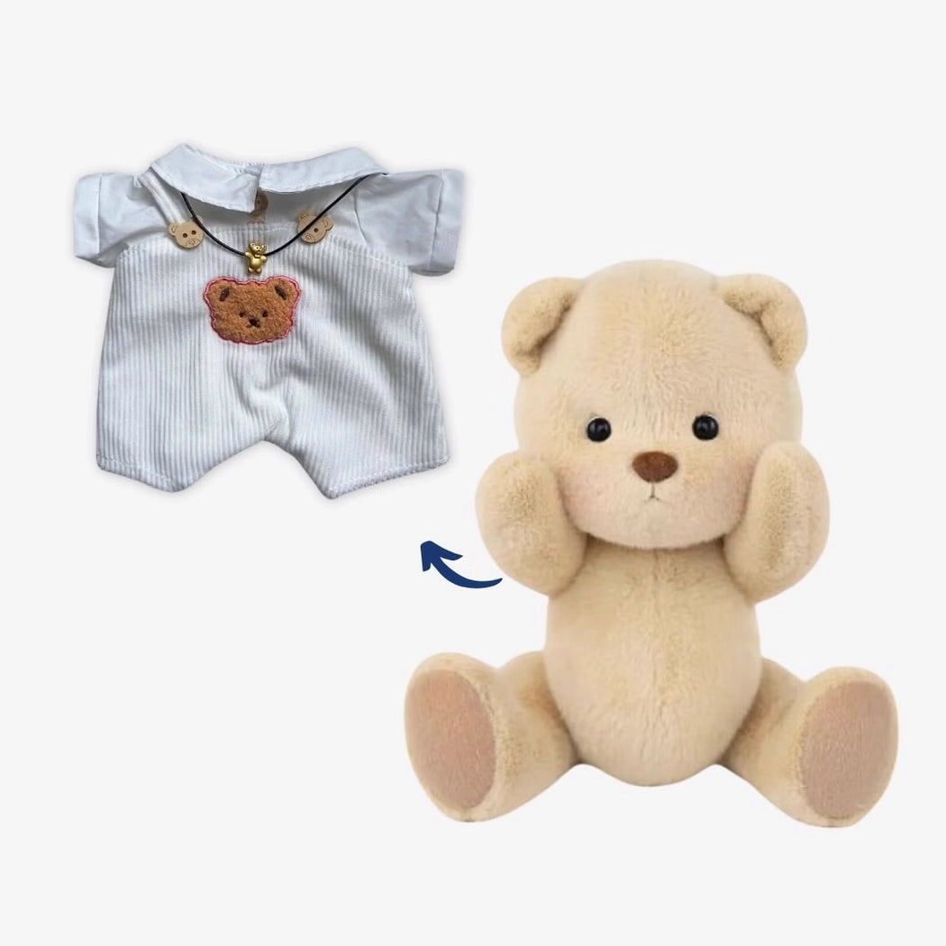 Ours en peluche en combinaison blanche