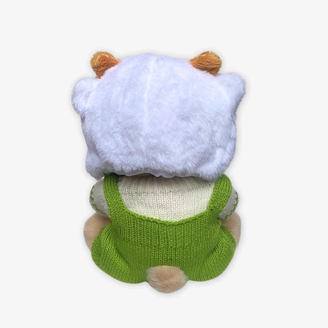 Ours en peluche en combinaison verte