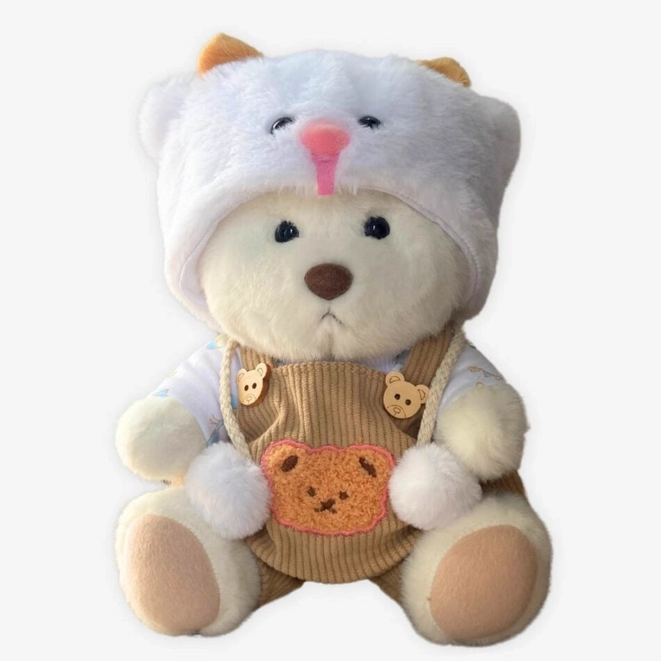 Ours en peluche déguisé en salopette marron