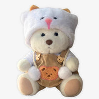 Ours en peluche déguisé en salopette marron