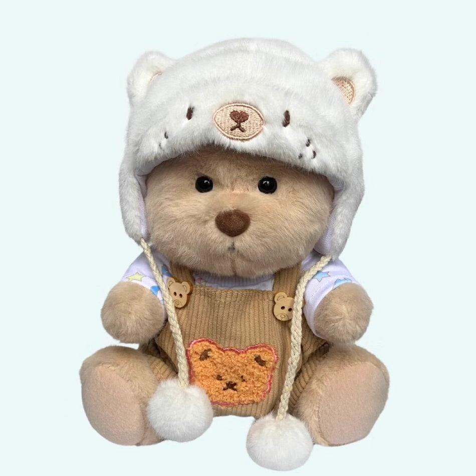 Ours en peluche déguisé en salopette marron