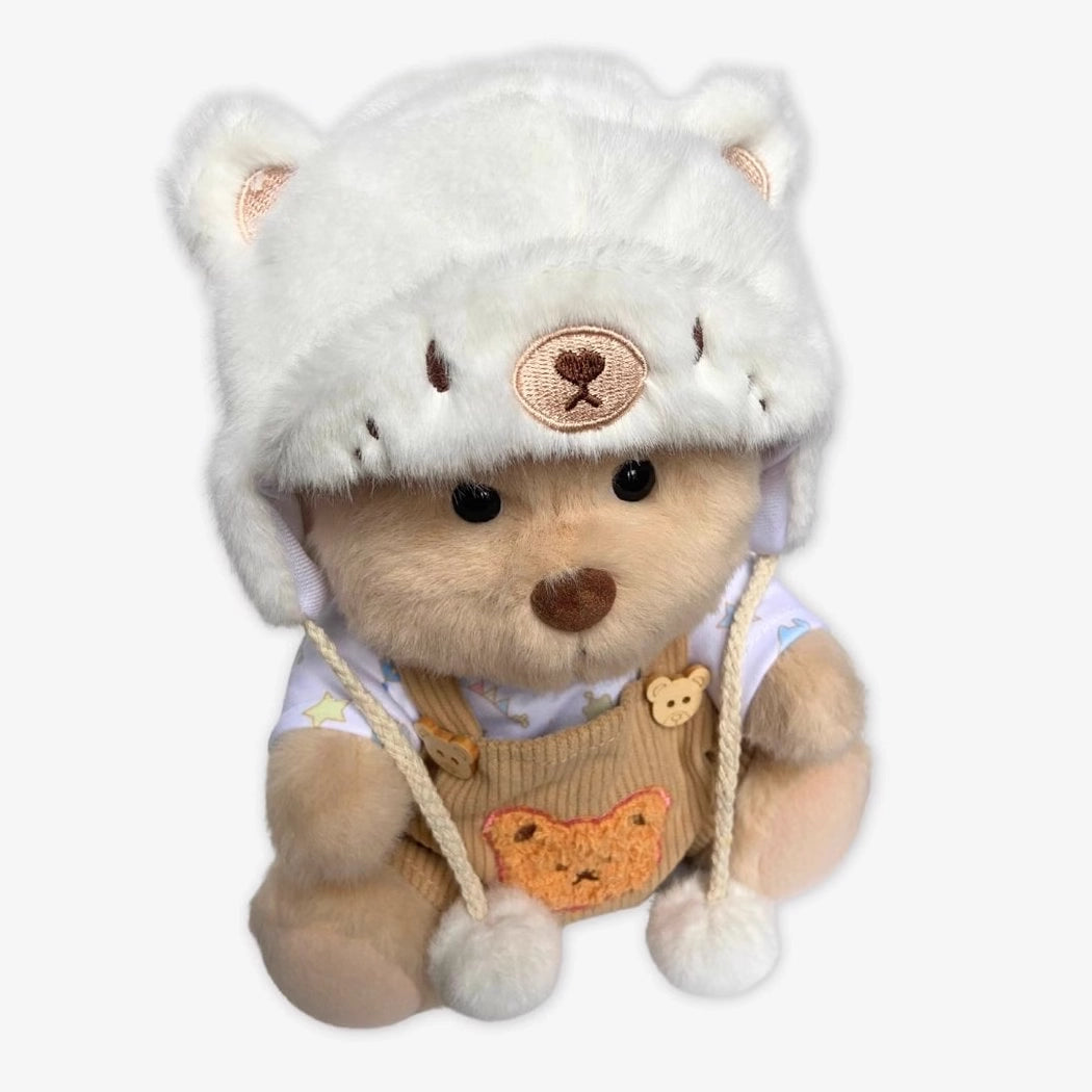 Ours en peluche déguisé en salopette marron