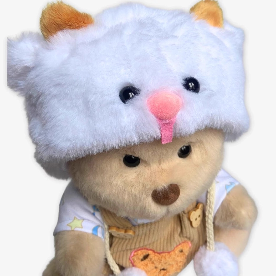 Ours en peluche déguisé en salopette marron