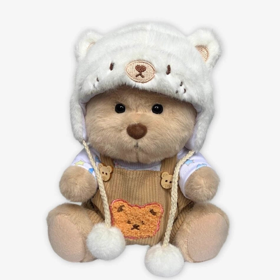 Ours en peluche déguisé en salopette marron