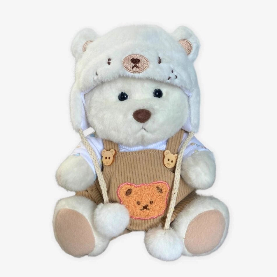 Ours en peluche déguisé en salopette marron