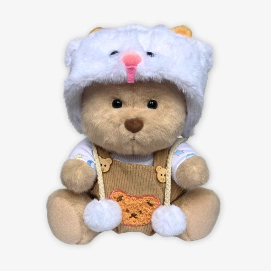 Ours en peluche déguisé en salopette marron
