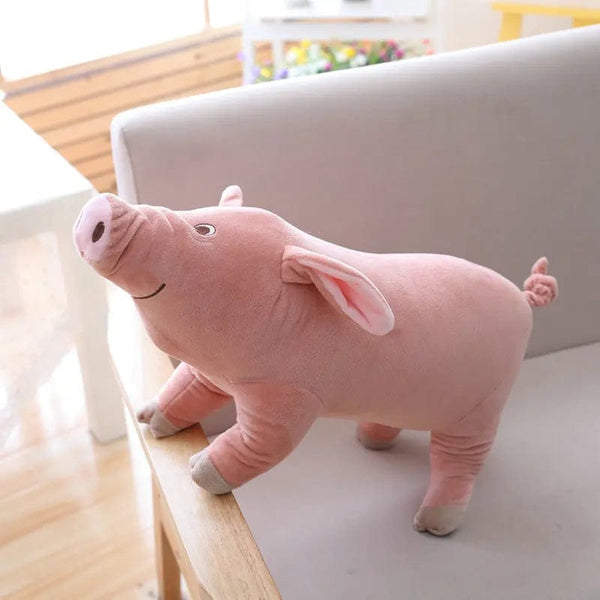 Peluche cochon rose mignon et content