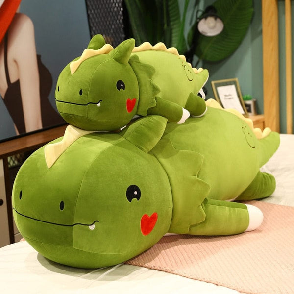 Peluche dinosaure avec un cœur sur la joue