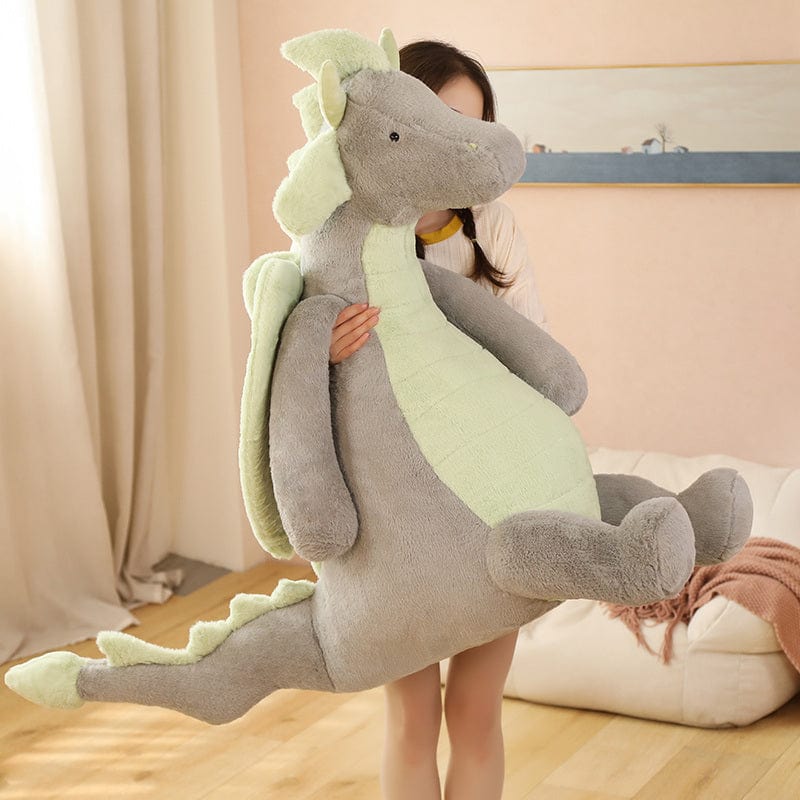 Peluche dragon doux assis