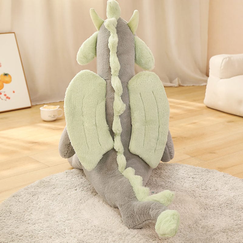 Peluche dragon doux assis