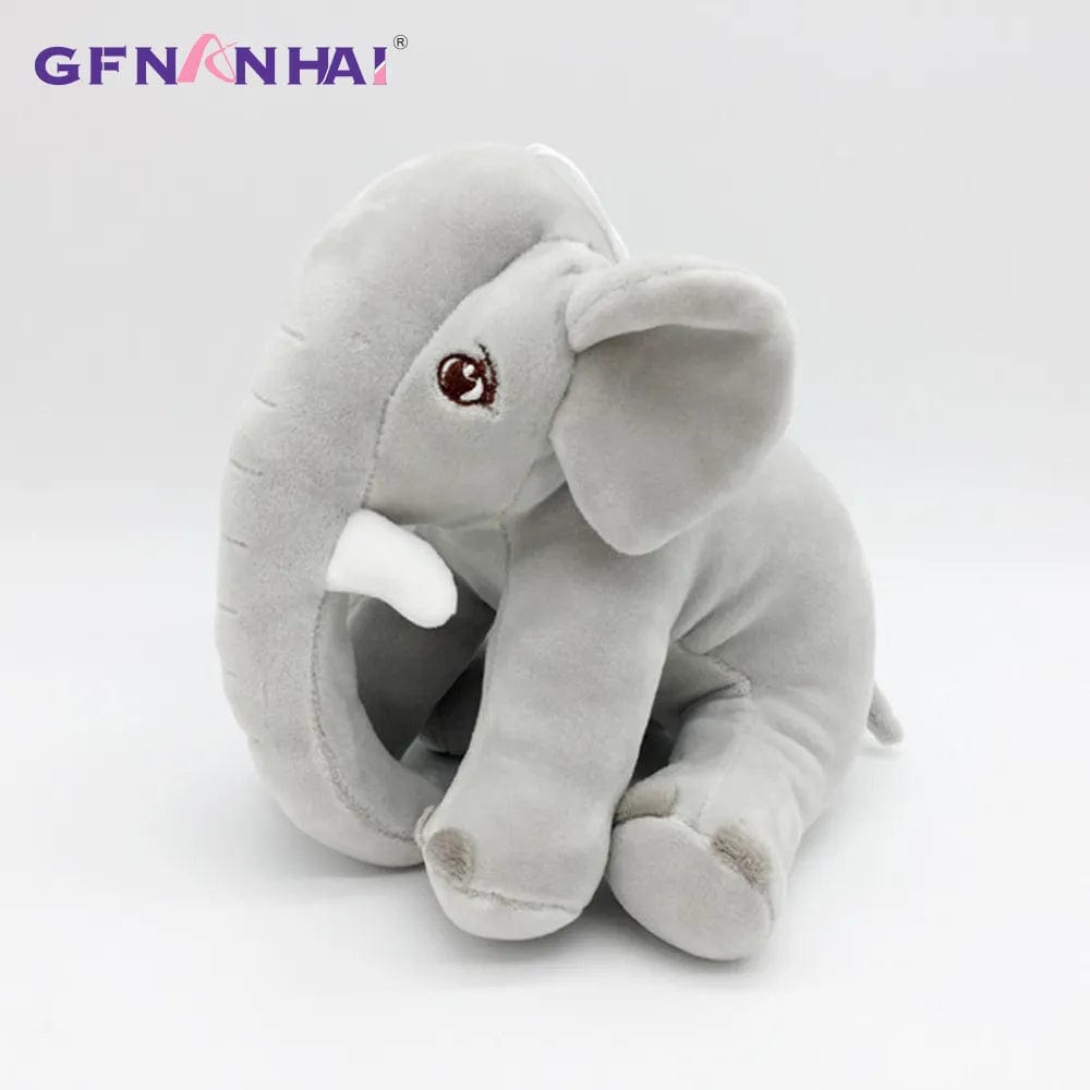 Peluche éléphant assis et content