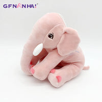 Peluche éléphant assis et content