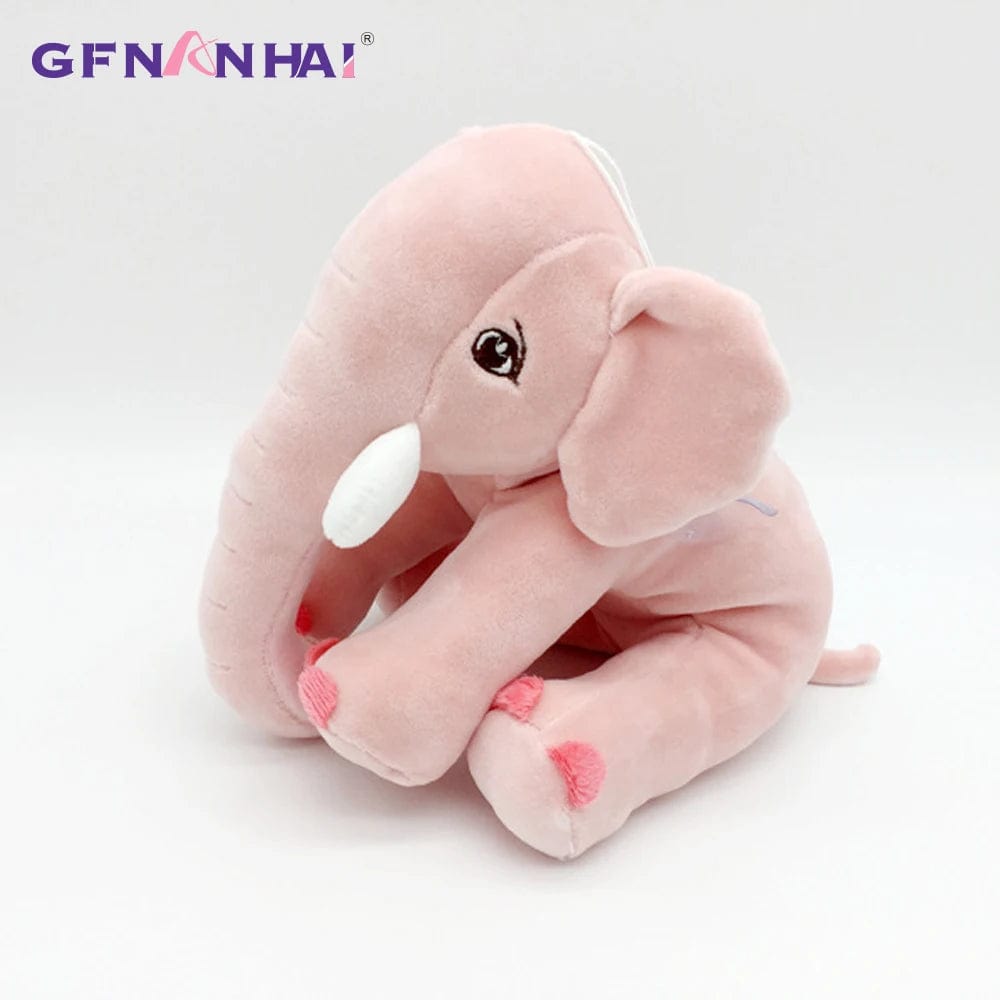 Peluche éléphant assis et content