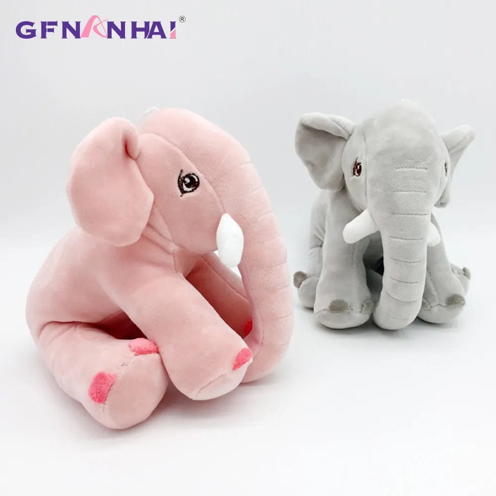 Peluche éléphant assis et content