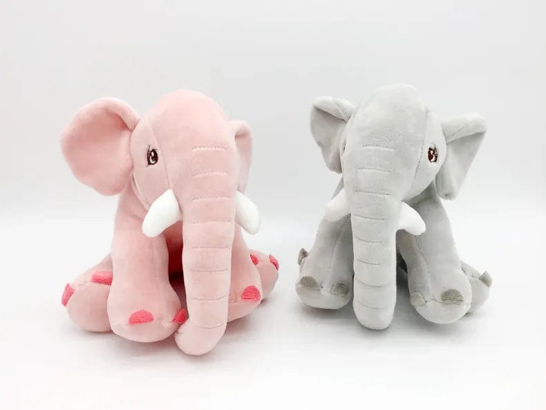 Peluche éléphant assis et content