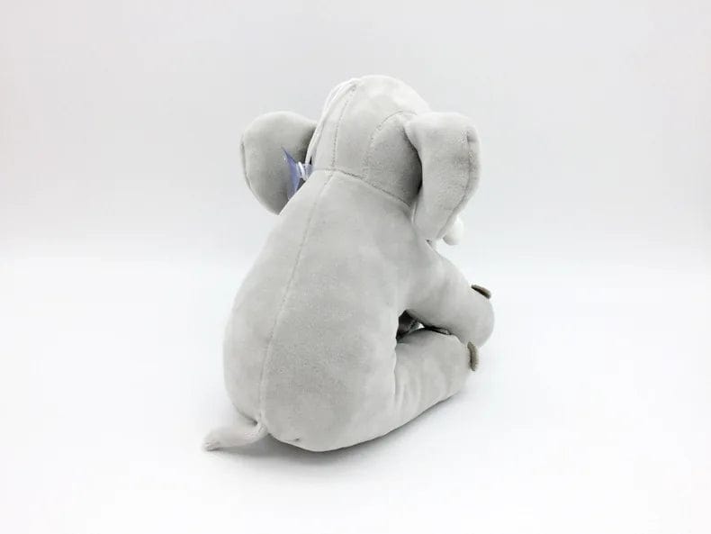 Peluche éléphant assis et content