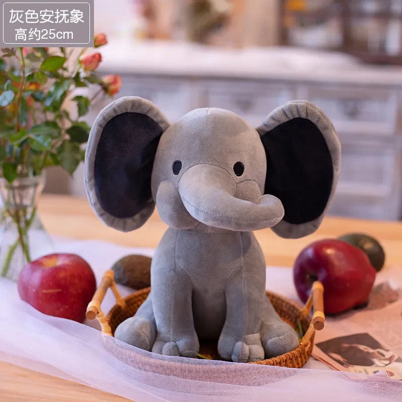 Peluche éléphant coloré avec sa trompe tordue Gris