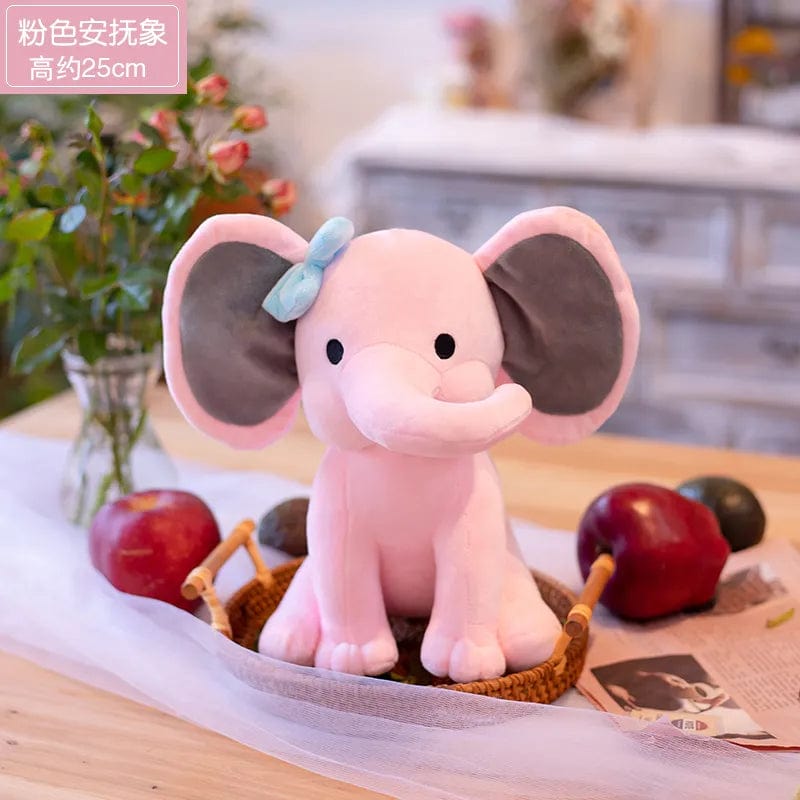Peluche éléphant coloré avec sa trompe tordue Rose