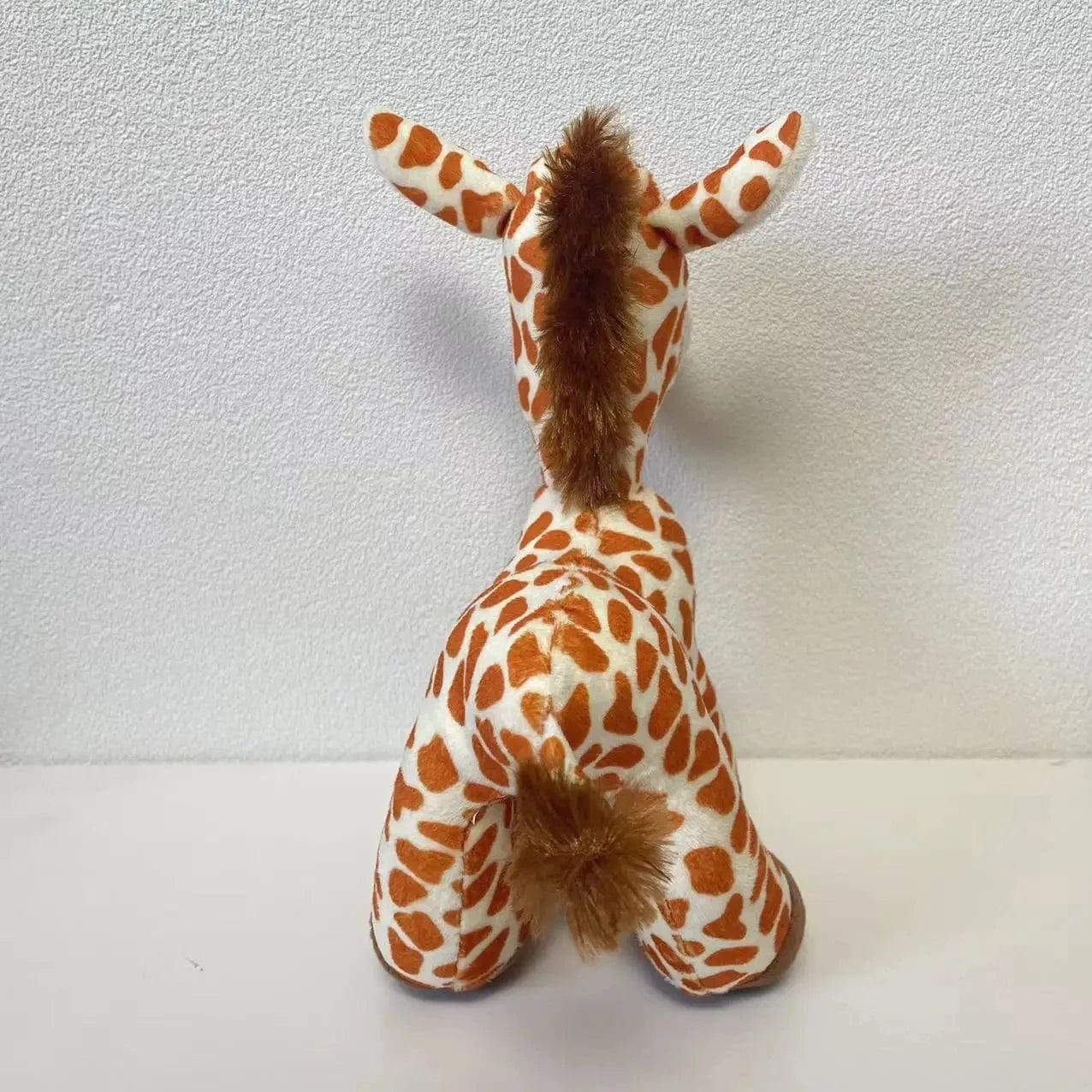 Peluche girafe aux gros yeux