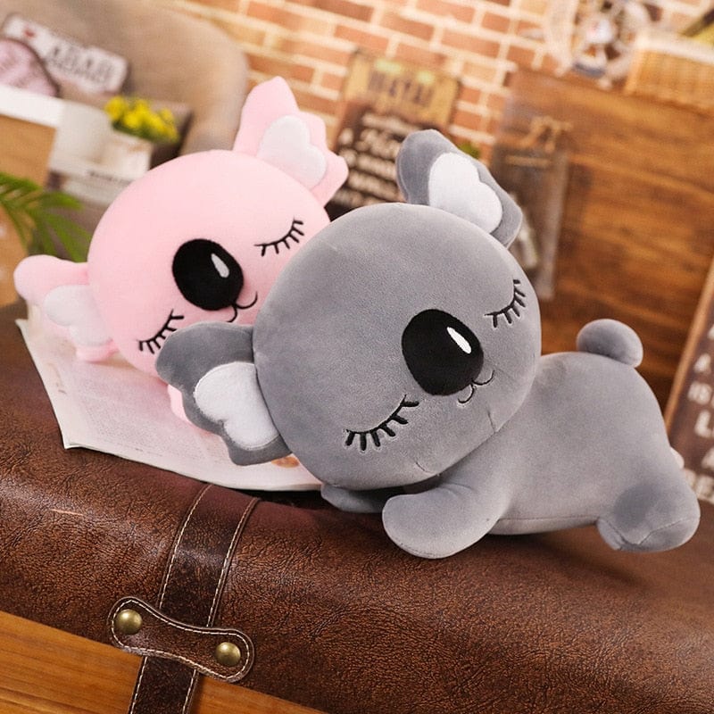 Peluche koala endormi avec de longs cils