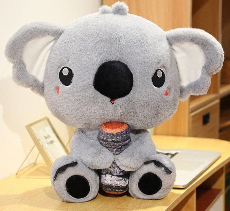 Peluche koala gris avec un gros nez