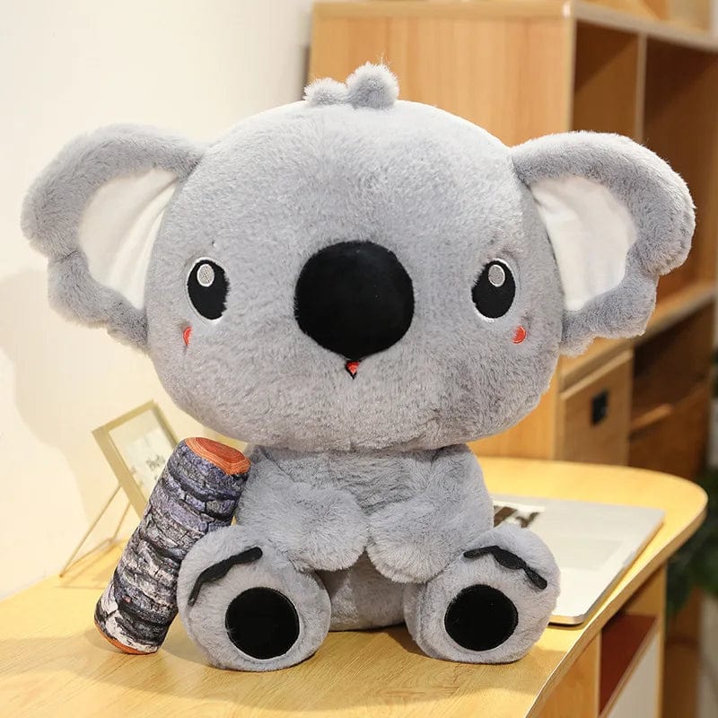 Peluche koala qui câline son bois 30cm