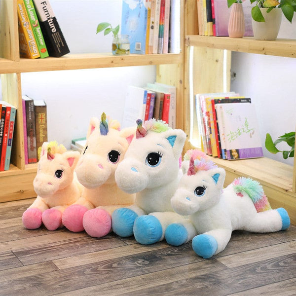 Peluche licorne avec des étoiles dans les yeux