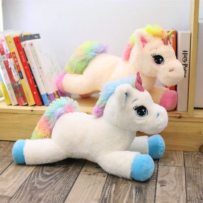 Peluche licorne avec des étoiles dans les yeux