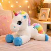 Peluche licorne avec des étoiles dans les yeux